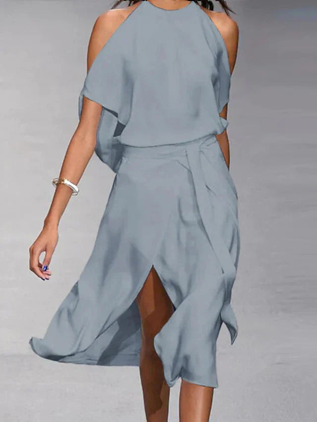 Madonnah - Elegantes Kleid mit modischen Schulterausschnitten.
