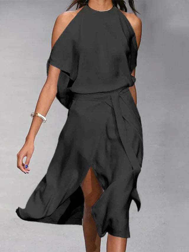 Madonnah - Elegantes Kleid mit modischen Schulterausschnitten.